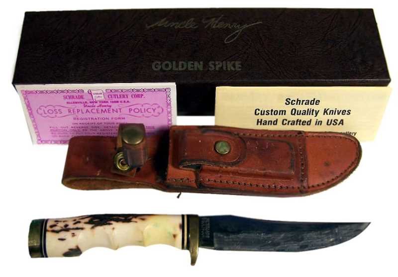 Schrade Uncle Henry Golden Spike 153UH: Vintage knife, includes sheath, sharping stone and box and papers. Light wear from use, good condition. The blade is approx. 7" long, box is 2.25" tall x 10.75" x 2.75".