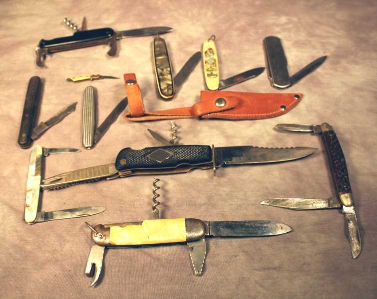 11 Vintage German Pocket Knives: Combination fixed blade folding tool knife with leather sheath, saw, cork screw, file and pick, fixed blade is approx. 3.625" long. 2 multi-tool pocket knives, Mother-of-Pearl inlay grip knife, PIC-75
