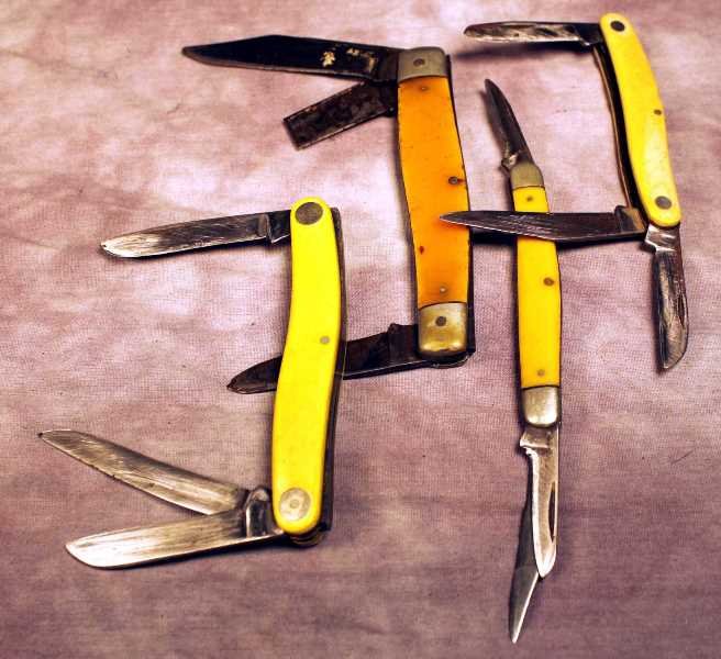 4 Kabar pocket knives: Kabar # 1097, # 1092 and 2 other Kabars without model numbers. The longest blade is approx. 3". Large orange gripped knife has a broken blade.