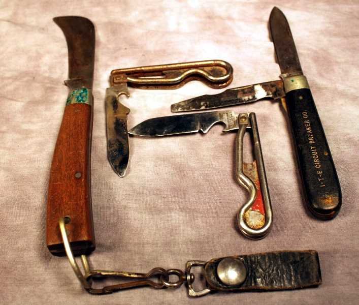 4 Schrade Utilitarian Knives: 2 skeletal body knives, patent dated 1942. A #205 Schrade knife and a #136 Hawkbill knife with an approx. 3.25" blade. Used condition.