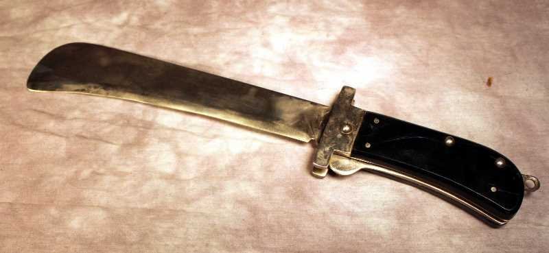 Pocket Machete: Large Folding Pocket Machete from Japan with plastic black grips. Total length approx. 16"