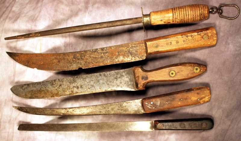 4 Anitque Butcher's Knives: I Wilson, Sycamore St. Sheffield, England Filleting Knife, 11.5" Blade; Old Hickory meat Knife, 12" w/ chips in blade; Johnson & Conway, Philadelphia Long Blade, 11" blade; Unmarked slicing knife 12"