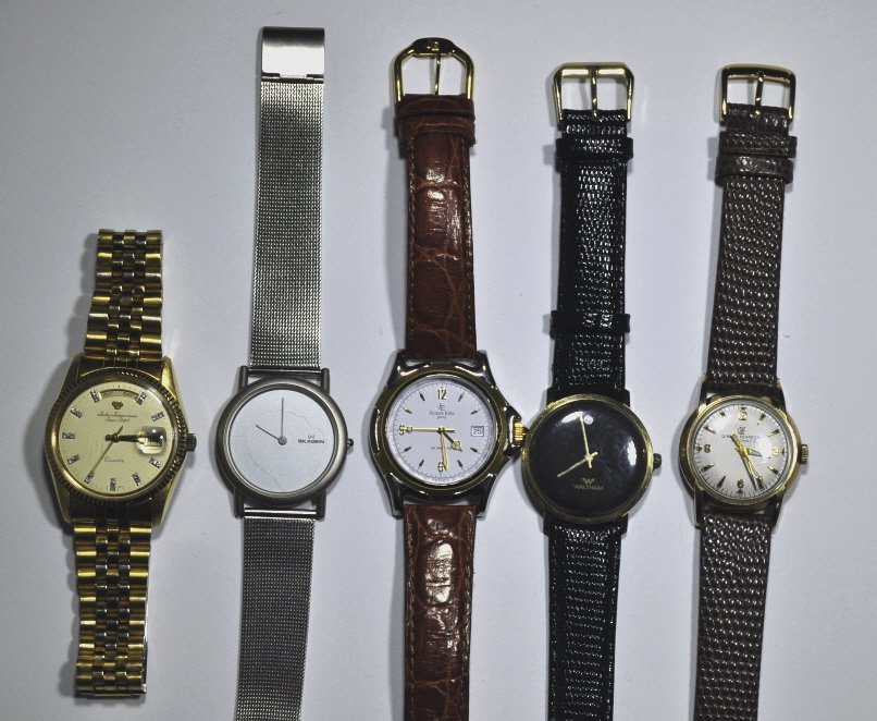 Five Vintage and Contemporary Gentleman's Watches: Comprising various models and styles, to include Skagen, Waltham, Perregaux, Edho, and Jorgenson.