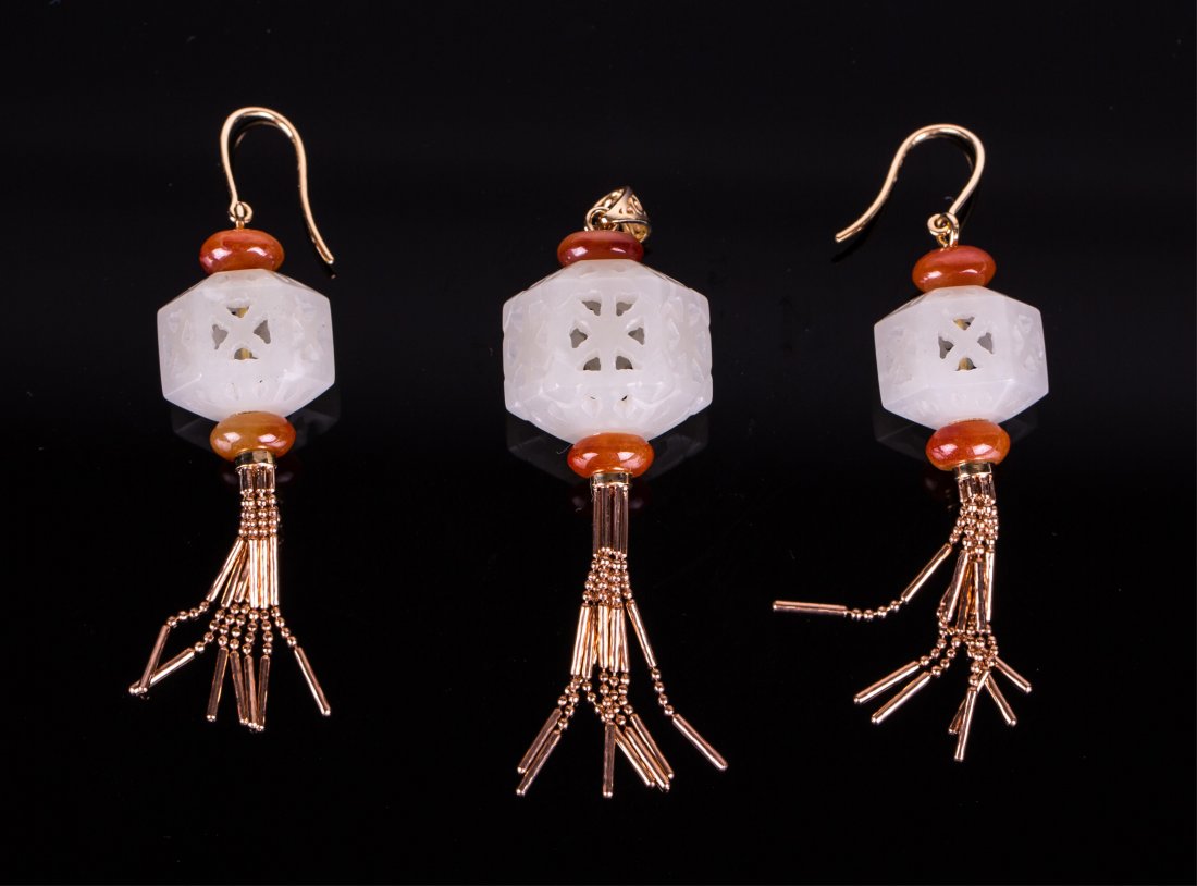 A PAIR OF JADE EARRINGS AND A PENDANT: Qing dynasty, each consists of a hexagonal white jade beads carved in open work; pendant (3/4 in. w), earrings (1/2 in. w)