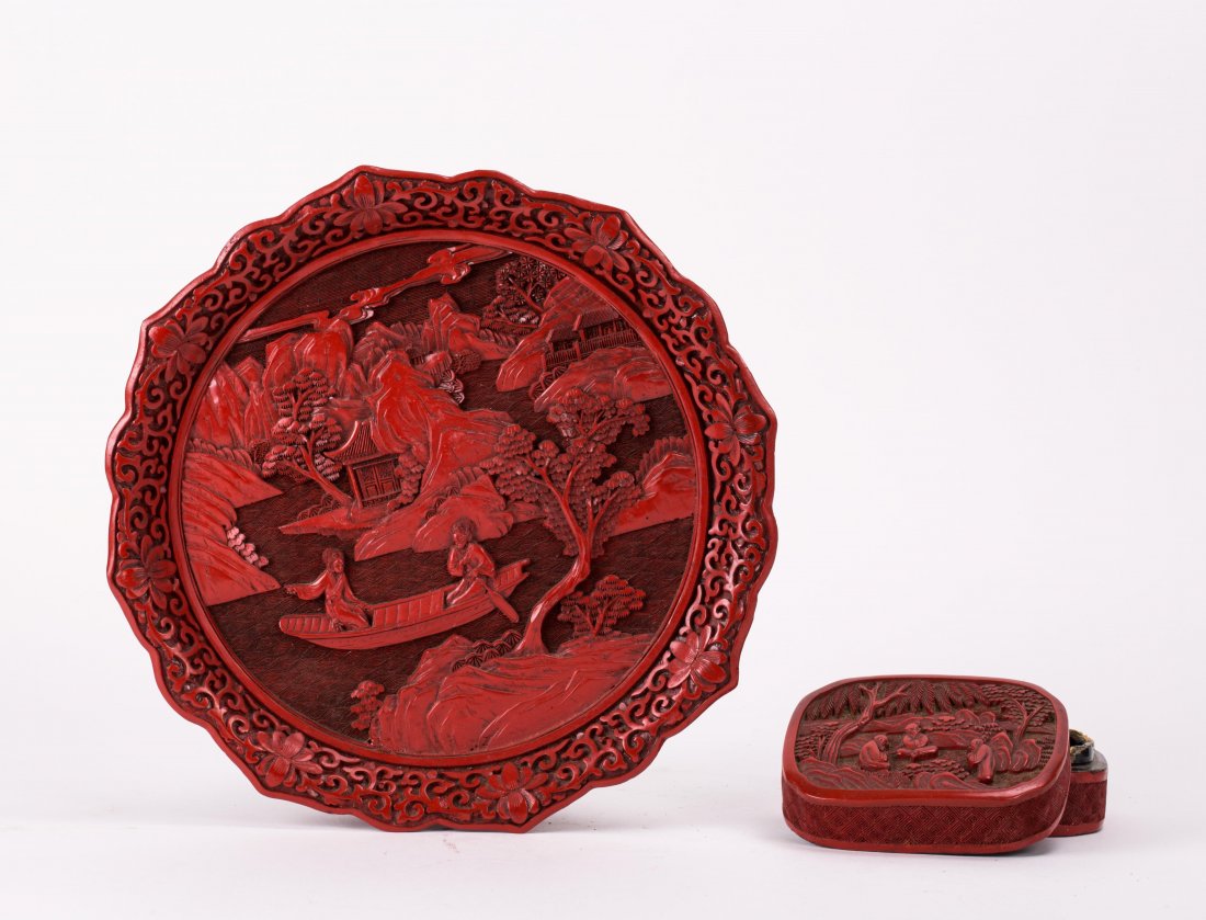 TWO CHINESE CARVED CINNEBAR ARTICLES: one foliated edge dish, one small box; dish (9 3/4 in. diameter), box (4 in. w)