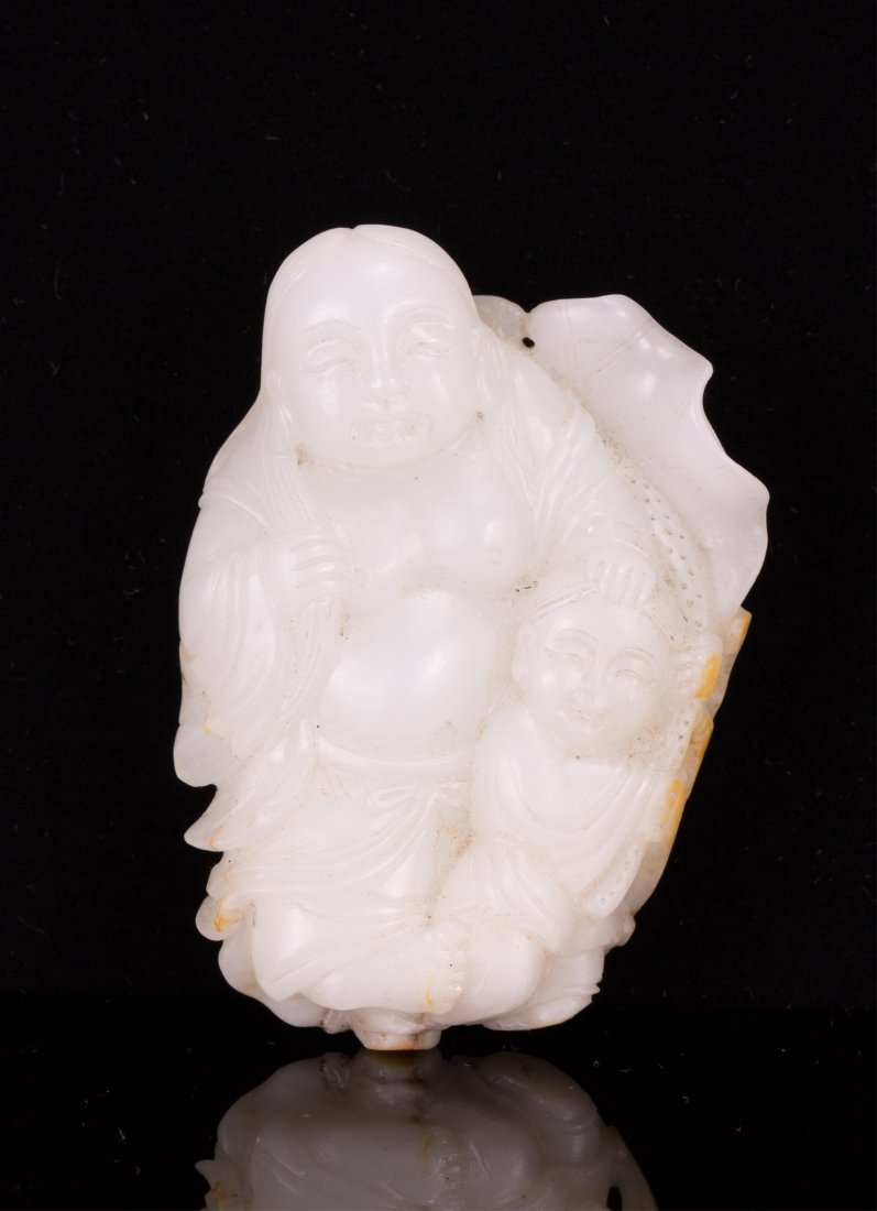 CHINESE JADE LOUHAI WITH BOY: 19th / 20th century; 2 1/2 in. h, 1 3/4 in. w