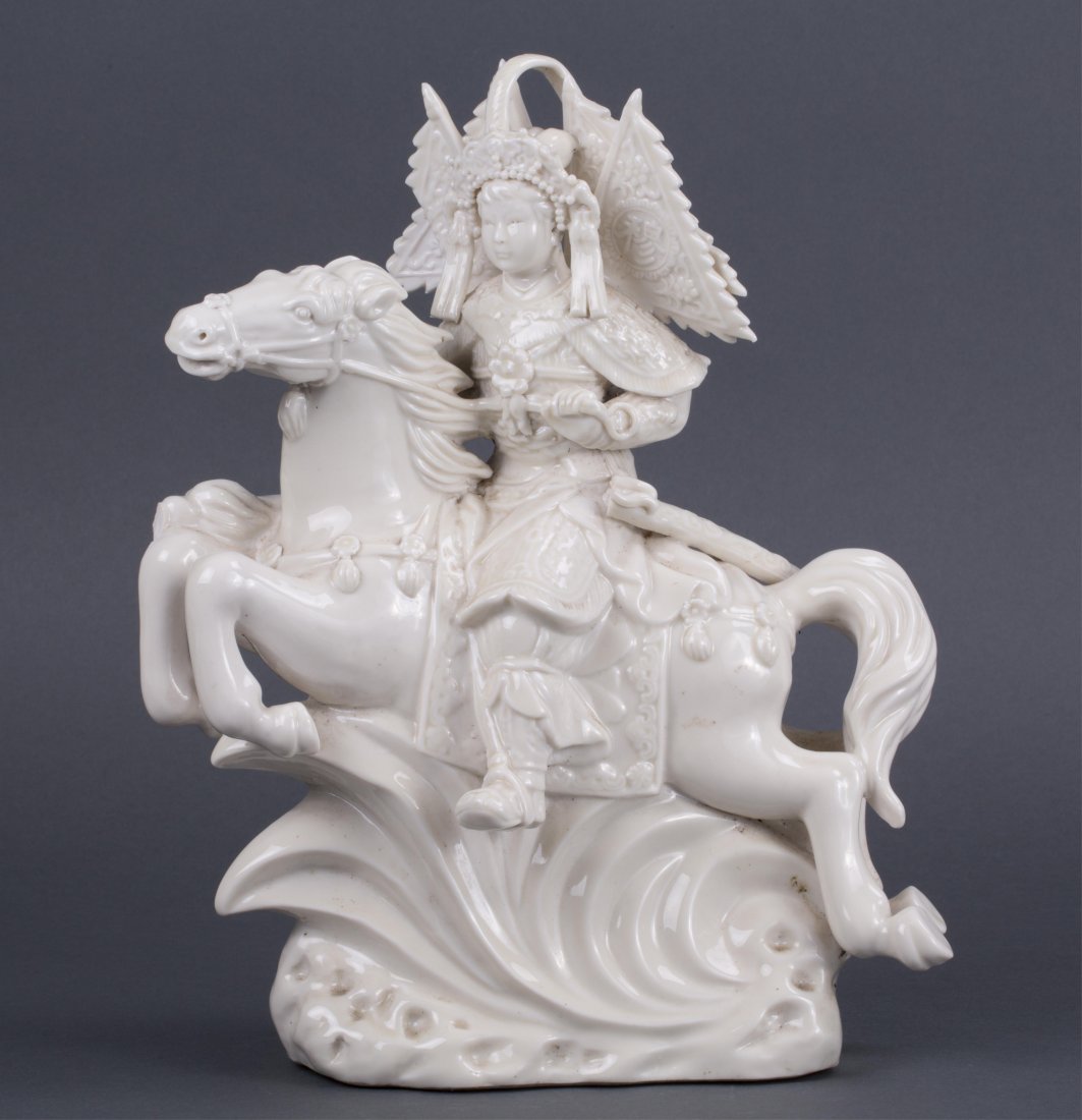 CHINESE BLANC DE CHINE PORCELAIN MULAN ON HORSE: 20th century, tip of sword break; 11 1/2 in. h, 8 1/2 in. w