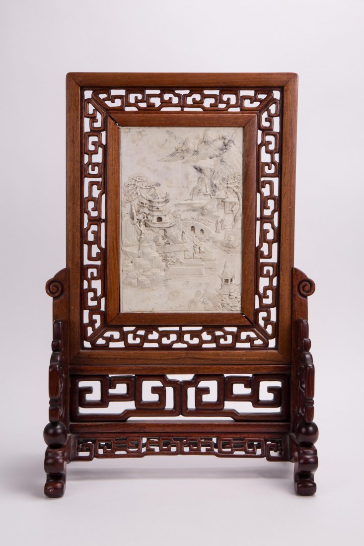 BISQUE PORCELAIN TABLE SCREEN WITH HARDWOOD BASE: 19th century, landscape scene; 19 1/2 in. h, 13 in. w