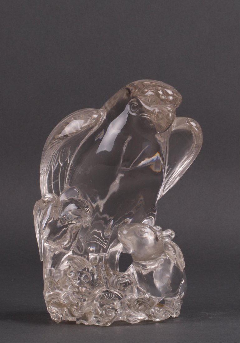 CHINESE ROCK CRYSTAL CARVING OF A HAWK: 19th / 20th century, heavy and clear crystal; 7 in. h, 4 1/2 in. w