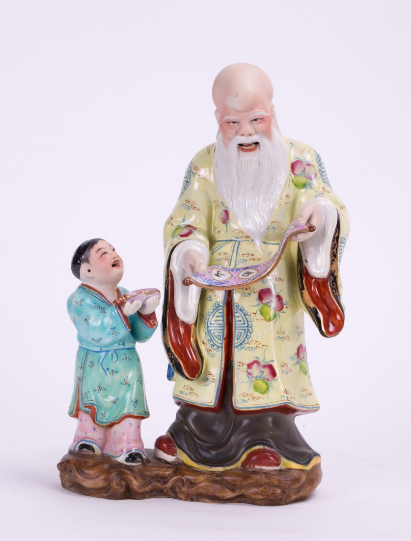CHINESE FAMILLE ROSE PORCELAIN SHOULAO AND CHILD: 20th century; 10 in. h by 6 1/2 in. w