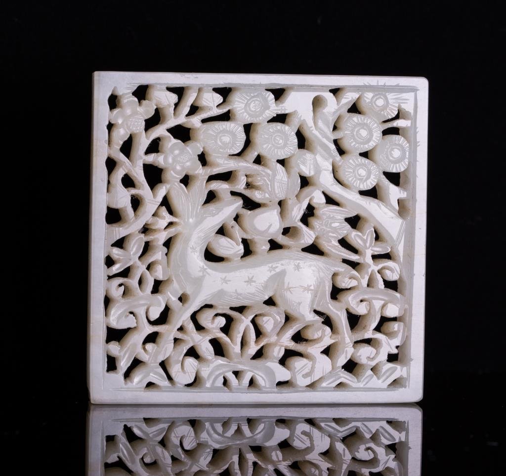 WHITE JADE CARVED DEER PLAQUE: Ming dynasty, rectangular white jade plaque carved deer with pine tree scene in open work; 2 1/4 by 2 1/4 by 3/8 in.