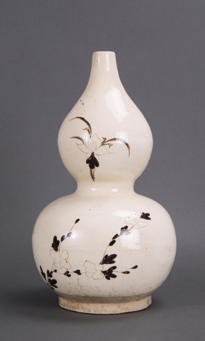 CHINESE CHIZHOU PORCELAIN DOUBLE GOURD VASE: Chinese Chizhou Porcelain Double Gourd Vase. 17th century or earlier, with incised lotus decoration; Provenance: Warren Cox Collection, bottom bears partial lable; 7 1/2 in. diameter (largest area), 1