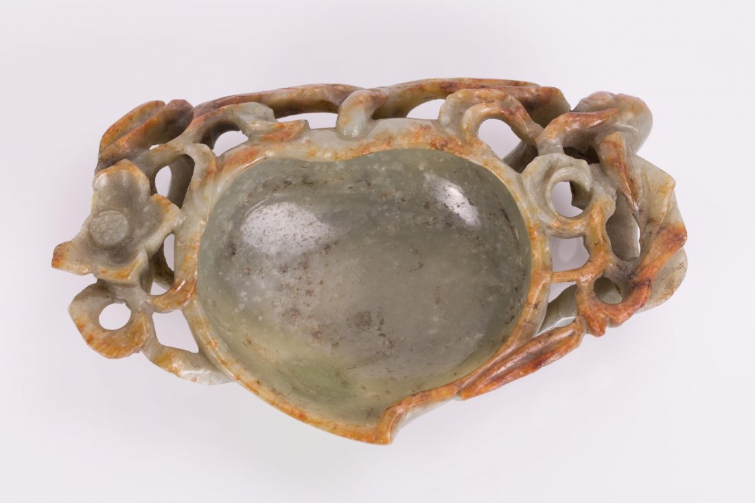 CHINESE CARVED JADEITE PEACH BRUSH WASHER: Chinese Carved Jadeite Peach Brush Washer. 19th century, green with yellow skin, edge chipped; 1 1/2 in. h, 5 in. w; 6.55 oz / 187 g