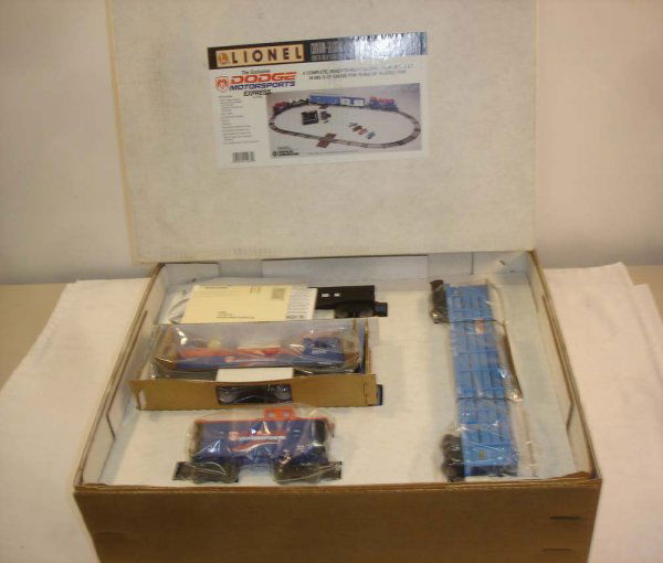 ABT: Mint Lionel #11933 Dodge Motorsports Set/OB: Paul V. Ambrose and Drew J. Bauer present: This is the #11933 Dodge Motorsports Express Train Set that Lionel made in the 1990s. This Uncatalogued Set features a SW-2 Switcher, a Box Car, a screened A