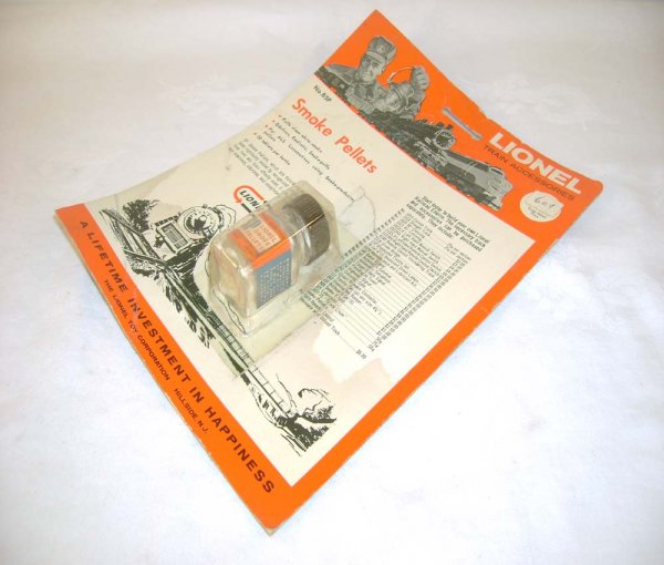 ABT: Mint Lionel #BSP Bottle of Smoke Pellets/ Bli: Paul V. Ambrose and Drew J. Bauer present: This is the #BSP Bottle of Smoke Pellets on a Blister that Lionel made in the 1960s. Our Opinion is that it generally in Mint Condition, no signs of use, sti