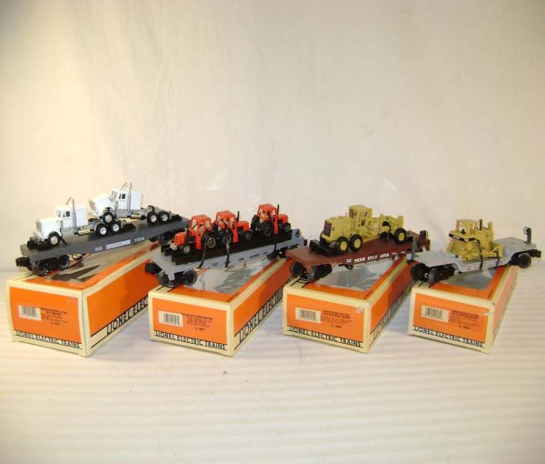 ABT: 4 Mint Lionel Flat Cars with Vehicles/1990s/OB: Paul V. Ambrose and Drew J. Bauer present: These are four Flat Cars with Diecast Vehicle Loads that Lionel made in the 1990s. Included are the #17515 Norfolk Southern Flat Car with Tractors, the #1690