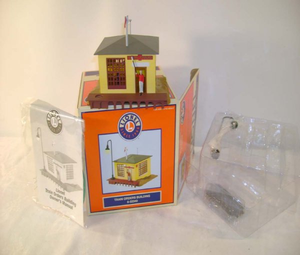 ABT: Lionel #52340 TCA Train Orders Building/OB: Paul V. Ambrose and Drew J. Bauer present: This is the #52340 TCA Train Orders Building that Lionel made a few years ago. This building features a man who comes out from the inside and throws a signal