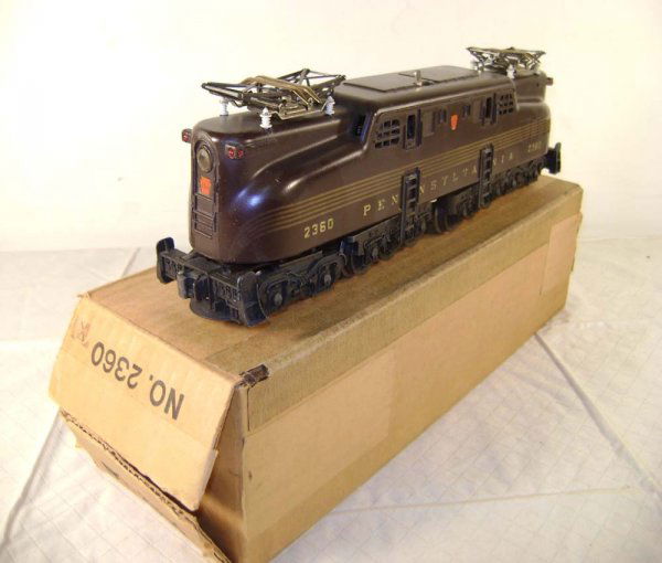 ABT: Lionel #2360 Penn Tuscan 5 Stripe GG-1/OB+: Paul V. Ambrose and Drew J. Bauer present: This is the #2360 Tuscan Five-Stripe Pennsylvania Electric with Dual Motors, Magnetraction, and Horn that Lionel made in 1956. Headed the 1956 version of the