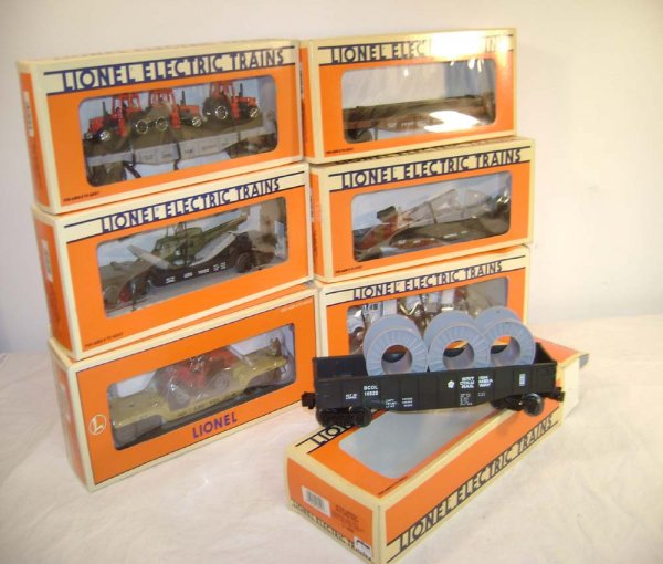 ABT: 7 Mint Lionel Flat Cars with Loads/OB III: Paul V. Ambrose and Drew J. Bauer present: These are seven Flat Cars with Loads that Lionel made over the past few decades. Included are the #17515 Norfolk Southern Flat Car with Tractors, the #16957