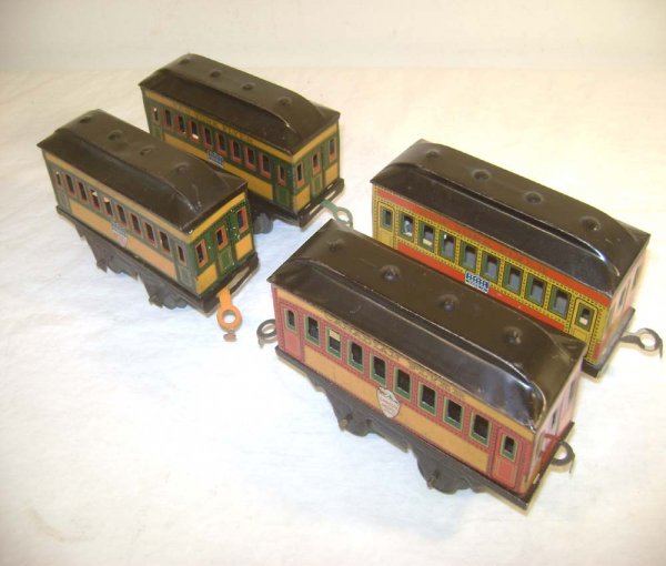 ABT: 4 Hafner O Gauge Short Passenger Cars/NY Flye: Paul V. Ambrose and Drew J. Bauer present: These are four short passenger cars that Hafner made in O Gauge in the 1920s. Includes three New York Flyer Parlor Cars with American stickers and a Canadian