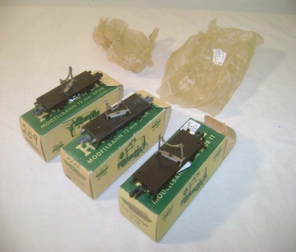 ABT: 3 TT Rokal #00209 Flat Cars/OBs: Paul V. Ambrose and Drew J. Bauer present: These are 3 #00209 Flat Cars that Rokal made in TT Gauge in the 1950s. Our Opinion is that it is generally in Like New Condition, minor signs of use. The Ori