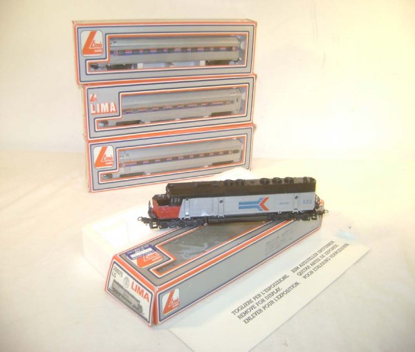ABT: HO - Lima #208075 LG Amtrak Engine & 3 Passen: Paul V. Ambrose and Drew J. Bauer present: These are the Lima #208075 LG Amtrak Engine & 3 Passenger Cars #303602/303600/303601 that AHM made in HO Gauge in the 1970s. Our Opinion is that it is genera