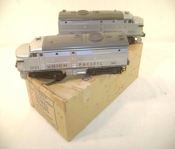 ABT: Nice Lionel #2023 Silver/Gray Union Pacific A: Paul V. Ambrose and Drew J. Bauer present: These are the #2023 Union Pacific Alco Diesels with Magnetraction, Headlights and Horn that Lionel made in 1951. Silver body with Gray Roofs and near-perfect