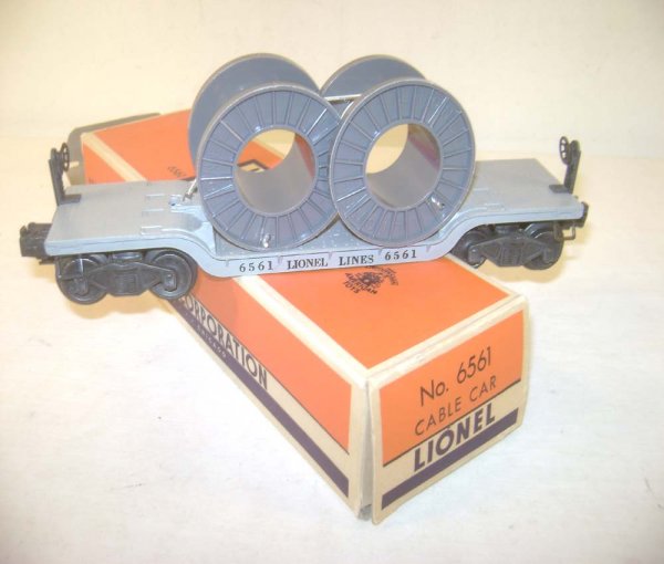 ABT: Lionel #6561 Flat Car with Gray Cable Reels/O: Paul V. Ambrose and Drew J. Bauer present: This is the #6561 Diecast Flat Car with Gray Cable Reels that Lionel made in the early 1950s. Our Opinion is that it is generally in Excellent Condition. The