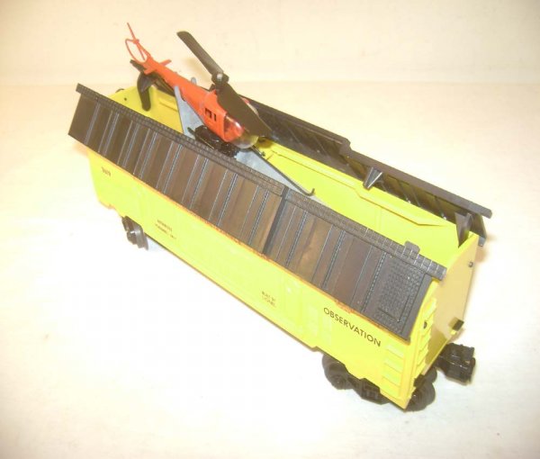 ABT: Lionel #3619 Yellow Reconnaissance Car: Paul V. Ambrose and Drew J. Bauer present: This is the #3619 Light-Yellow Operating Reconnaissance Car with Red Helicopter that Lionel made in the early 1960s. Reproduction Helicopter. Our Opinion is 