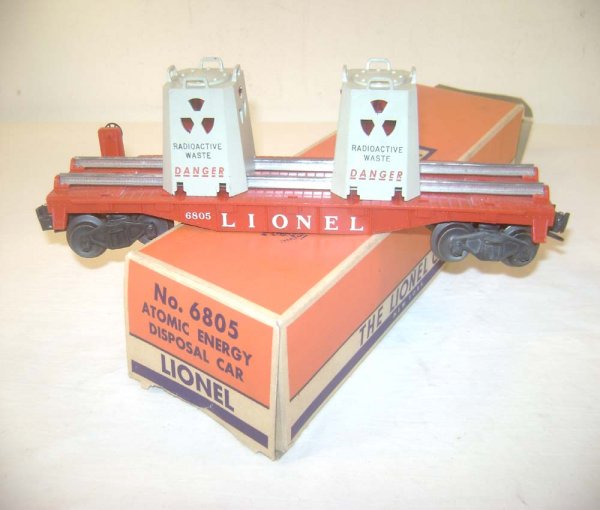 ABT: Lionel #6805 Flat Car with AEC Canisters/58B : Paul V. Ambrose and Drew J. Bauer present: This is the #6805 Flat Car with Illuminated AEC Canisters that Lionel made circa 1958. Our Opinion is that it is generally in Excellent Plus Condition, minor