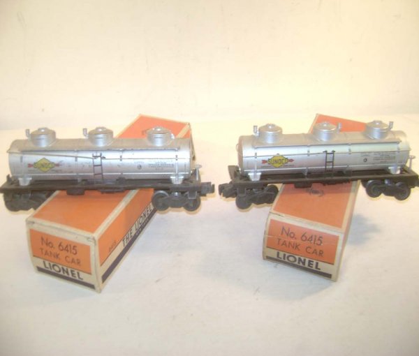 ABT: 2 Lionel #6415 Sunoco Three-Dome Tank Cars/OB: Paul V. Ambrose and Drew J. Bauer present: These are two #6415 Sunoco Three-Dome Tank Car that Lionel made in the middle 1950s. Variations with "6415" at bottom of Technical Data. Our Opinion is that 