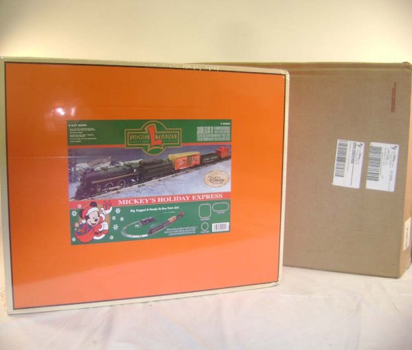 ABT: Mint /Sealed Lionel #99001 Mickey's Holiday E: Paul V. Ambrose and Drew J. Bauer present: This is the #99001 Mickey's Holiday Express Train Set that Lionel made a few years ago as an uncatalogued offering through the Disney Catalog. Includes the f