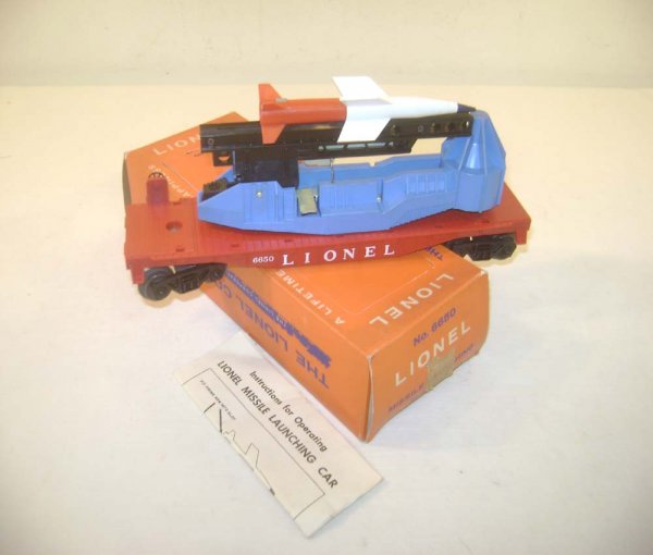 ABT: Lionel #6650 Missile Firing Flat Car/OB: Paul V. Ambrose and Drew J. Bauer present: This is the #6650 Missile Firing Flat Car that Lionel made in 1959 and into the early 1960s. Number on Left. Our Opinion is that it is generally in Like New 