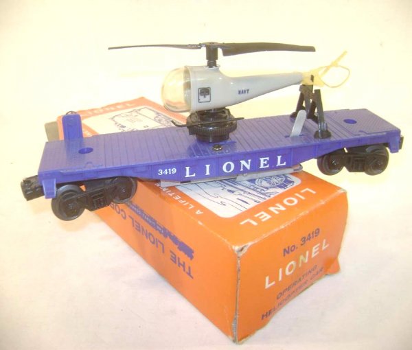 ABT: Lionel #3419 Operating Helicopter Car/Pix OB: Paul V. Ambrose and Drew J. Bauer present: This is the #3419 Operating Helicopter Car that Lionel made in the early 1960s. Small winder and correct single-blade Helicopter with a break on the rear Rot