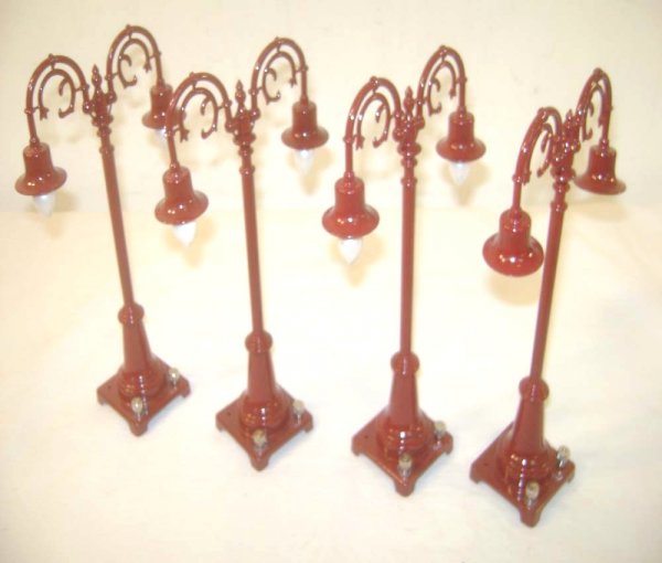 ABT: 4 MTH #54 Maroon Double Gooseneck Lamps: Paul V. Ambrose and Drew J. Bauer present: These are four #54 type Maroon Double Gooseneck Lamps that MTH made a few years ago as a remake of the Lionel Accessory from the 1920s. Our Opinion is that t