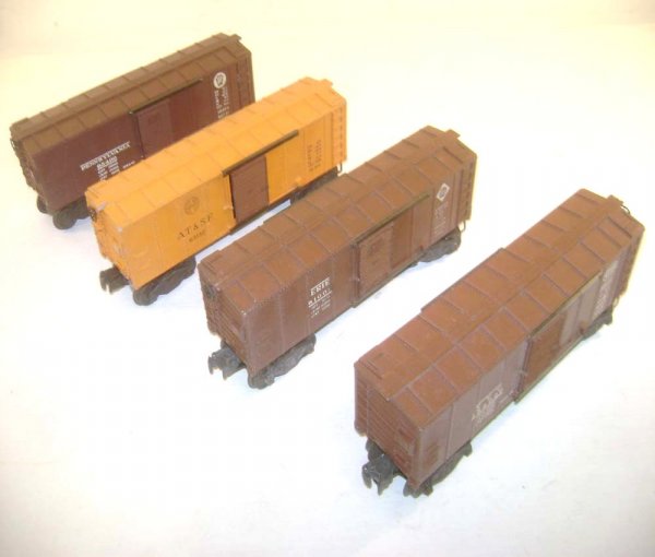 ABT: Four Lionel #6454-type Boxcars: Paul V. Ambrose and Drew J. Bauer present: These are four 9 1/4-inch #6454 Box Cars that Lionel made in the Post-War Period, in this case late 1940s to early 1950s. Included are the #6454 Erie, #6454 
