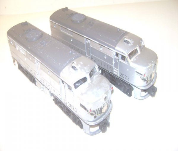 ABT: Lionel #2023 Silver/Gray Union Pacific Alco D: Paul V. Ambrose and Drew J. Bauer present: These are the #2023 Union Pacific Alco AA Diesels with Magnetraction, Headlights, and Horn that Lionel made in 1951. Silver body with Gray Roofs. Our Opinion
