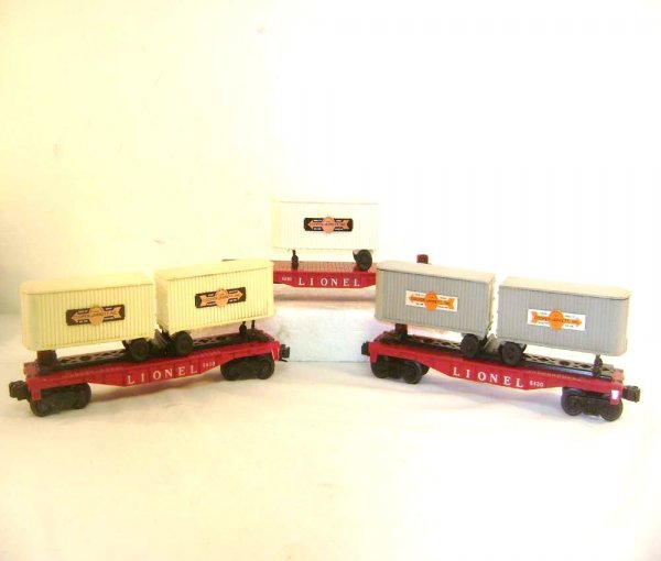 ABT: Two Lionel #6430 Flat Cars w/Vans & #6810 Fla: Paul V. Ambrose and Drew J. Bauer present: This is the #6810 and two #6430 Flat Cars with Van(s) that Lionel made in the middle 1950s. Our Opinion is that they are generally in Excellent Minus Conditi