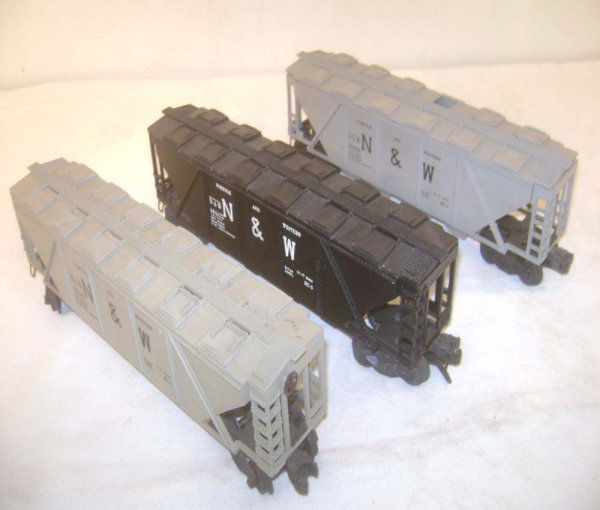 ABT: 3 Lionel #6446 N&W Covered Hoppers: Paul V. Ambrose and Drew J. Bauer present: These are three #6446 Norfolk & Western Covered Hoppers that Lionel made in the 1950s. Included are two Gray and one Black model. Some loose and one missing