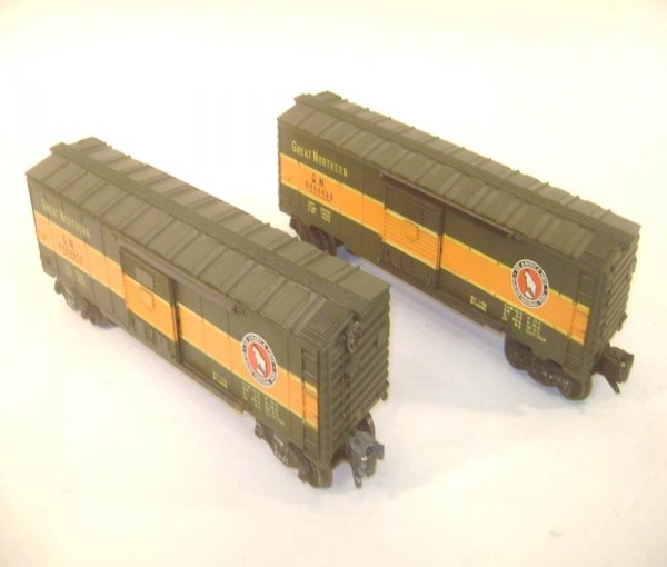 ABT: 2 Lionel #6464-450 Great Northern Box Cars/Ty: Paul V. Ambrose and Drew J. Bauer present: These are two #6464-450 Great Northern Box Cars that Lionel made in the later 1950s. Type IIB body. Our Opinion is that they are generally in Excellent Condi