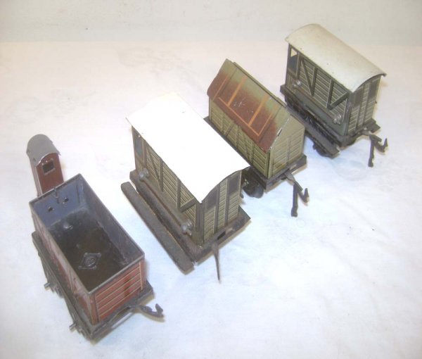 ABT: 4 Assorted 3-inch O Gauge Bing Vans: Paul V. Ambrose and Drew J. Bauer present: These are four assorted 3-inch Vans that Bing made in O-gauge circa the 1930s. a very nice grouping of small-size Rolling Stock. Our Opinion is that they are