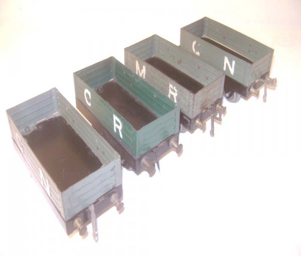 ABT: 4 Early Hornby MLL Open Goods Vans: Paul V. Ambrose and Drew J. Bauer present: These are four early Open Goods Vans with MLL designation in various Livery that Hornby made in O-gauge circa 1930. All examples with raised letters. Our Opi