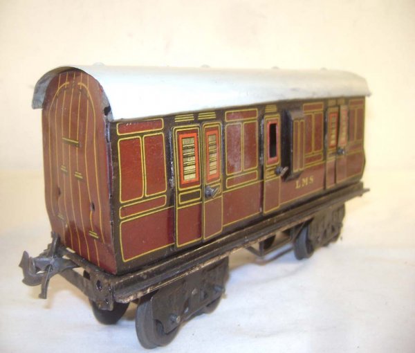 ABT: Nice Bing O-Gauge Composite LMS Wagon: Paul V. Ambrose and Drew J. Bauer present: This is the 9-inch LMS Composite Wagon that Bing made in O Gauge circa the 1930s. Note hinged doors and extended Bay for Guard. Our Opinion is that it is gen