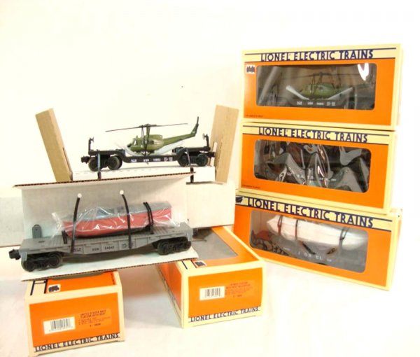 ABT: 5 Mint Lionel Assorted Flat Cars with Loads/OBs: Paul V. Ambrose and Drew J. Bauer present: These are five Assorted Flat Cars that Lionel made a few years ago. Included are two #16952 US Navy Flatcar with Ertl Helicopter, the #16939 US Navy Flatcar 