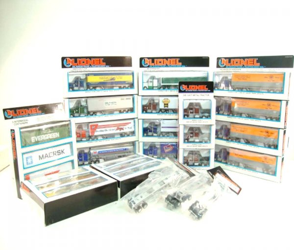 ABT: 12 Mint Lionel Tractor Trailers/6 Trailer Fra: Paul V. Ambrose and Drew J. Bauer present: These are twelve Tractor Trailers, 6 Trailer Frames, 3 Intermodal Containers, and 3 Die Cast Tractors that Lionel made a few years ago. Included are four #52