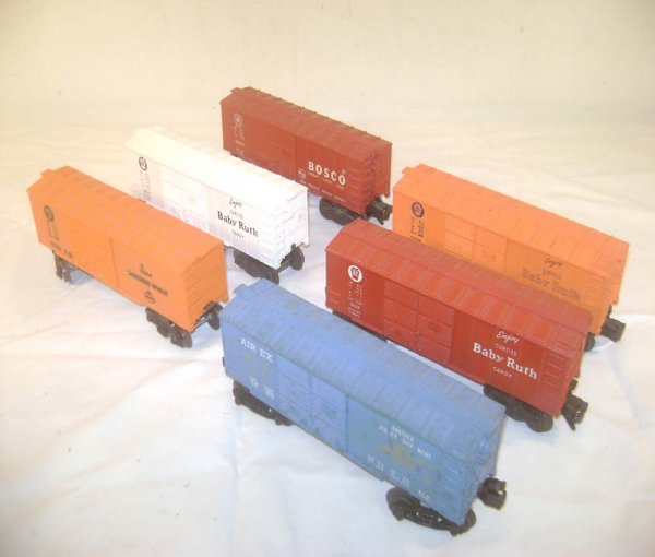 ABT: 6 Colorful Lionel 027-Gauge Box Cars: Paul V. Ambrose and Drew J. Bauer present: These are six short colorful 027-gauge Box Cars that Lionel made in the 1950s. Included are the #6004 Baby Ruth, three #6014 models, the #6024 Shredded Wheat