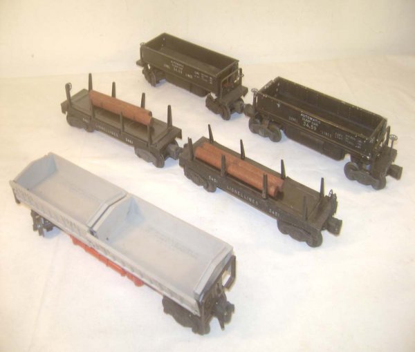 ABT: 5 Assorted Lionel Log/Ore Dump Cars: Paul V. Ambrose and Drew J. Bauer present: These are the #3359 Twin-Bin, the #3459 and #3469 Ore Dump Cars, plus the #3451 and #3461 Log Dump Cars that Lionel made in the late 1940s and 1950s. Please 