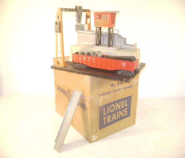 ABT: Lionel #345 Culvert Unloader Accessory/OB: Paul V. Ambrose and Drew J. Bauer present: This is the #345 Operating Culvert Unloader Accessory with the #6342 Culvert Gondola that Lionel made in the middle 1950s. Includes difficult Original Box. P