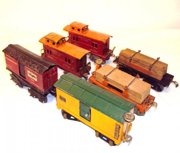 ABT: 6 Assorted American Flyer O Gauge Rolling Stoc: Paul V. Ambrose and Drew J. Bauer present: These are the #1112 Automobile Car, two #3017 Cabooses, the #3646 Lumber Car, plus an unnumbered Box Car and unnumbered Flat Car with Wood that American Flye