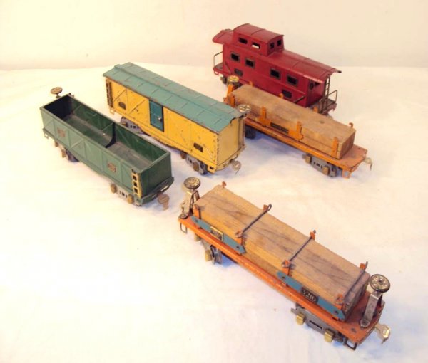 ABT: 5 American Flyer O Gauge Rolling Stock Items: Paul V. Ambrose and Drew J. Bauer present: These are five Rolling Stock items that American Flyer made in O Gauge circa the 1930s. Included are two Flat Cars w/Lumber Loads, Gondola, Box Car, and Cabo